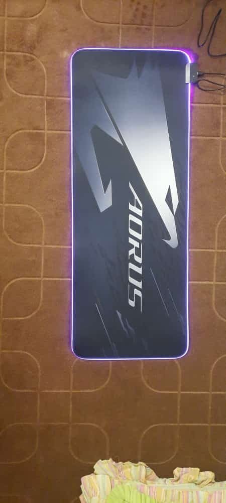 AORUS Gaming Mouse Pad lit up on desk