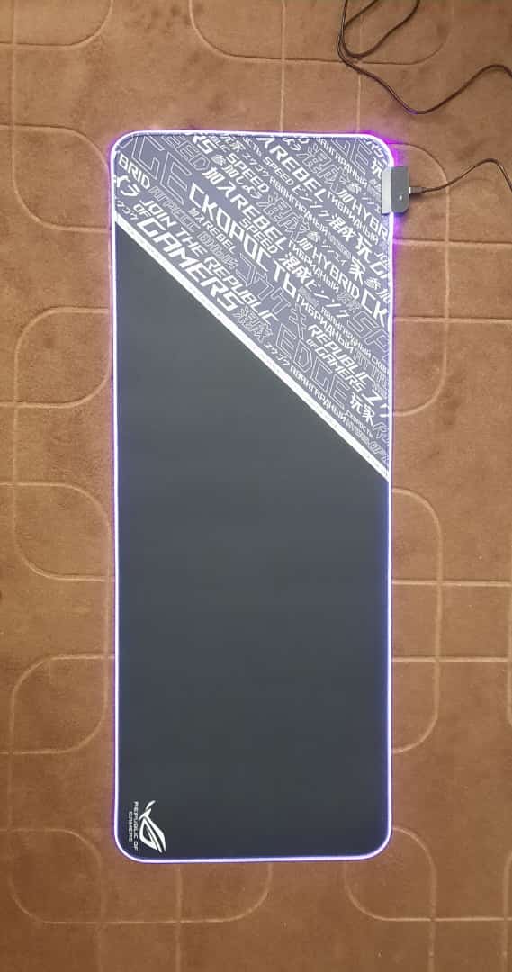 ROG Minimal Pattern Gaming Mouse Pad lit up on desk